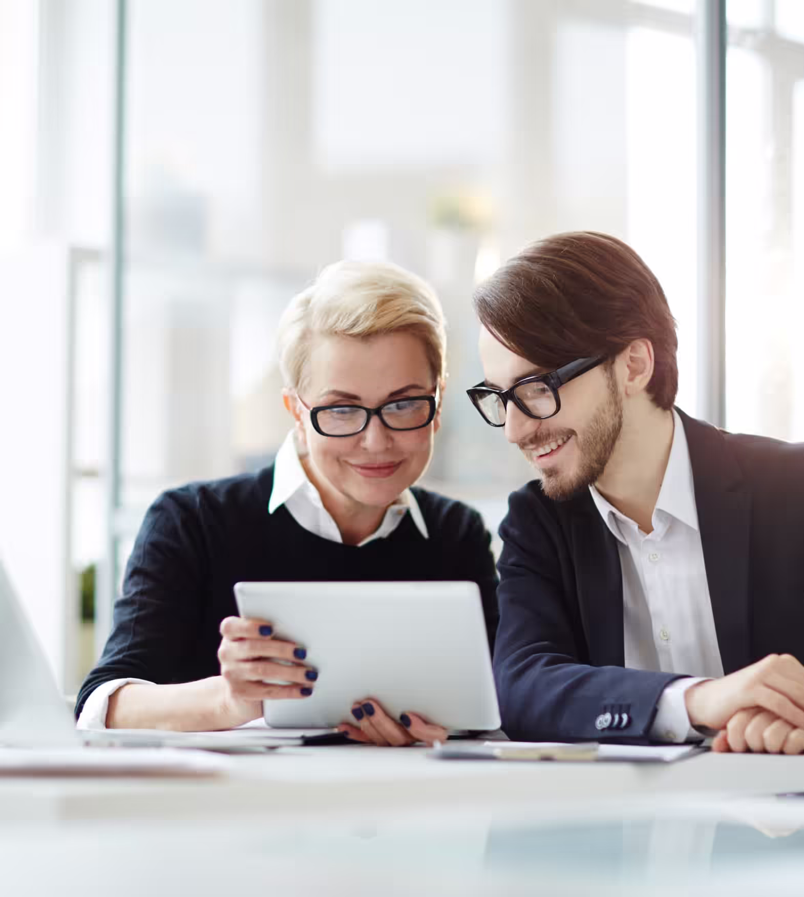 Promotions Contact Us Two persons looking at a tablet